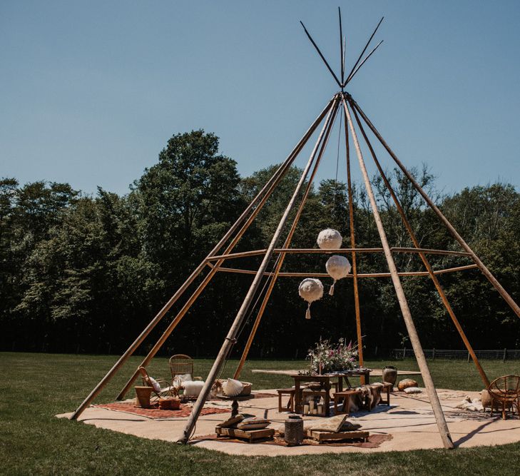 Outdoor naked tipi seating area at Wickerwood Farm