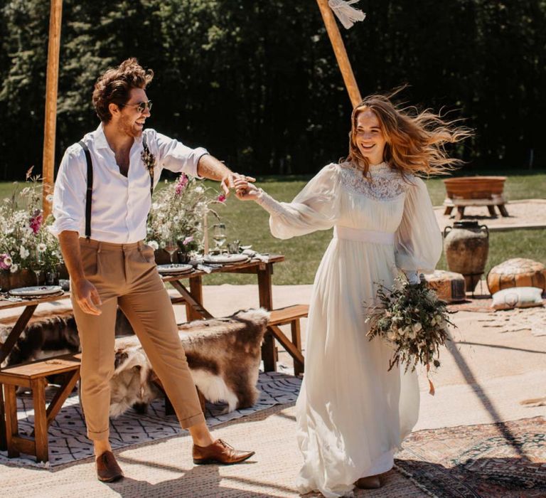 Bride and groom dancing at intimate outdoor reception