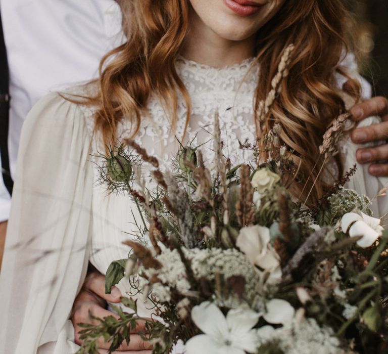 Beautiful boho bride with high neck wedding dress and flower crown