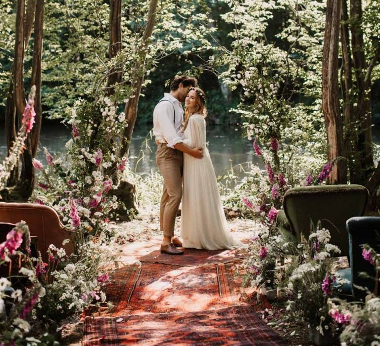 Aisle and altar style with wildflowers and moroccan rugs