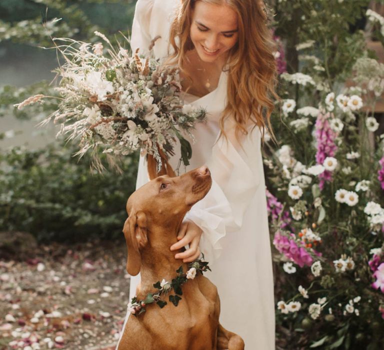 Boho bride with pet dog at sustainable wedding at Wickerwood Farm