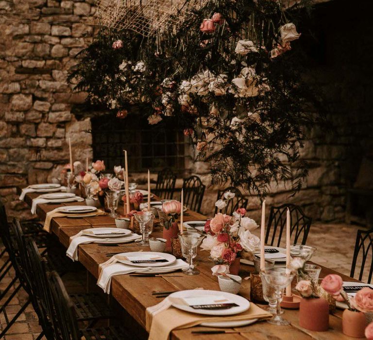 Outdoor Rustic Tablescape with Taper Candles, Floral Centrepieces and Hanging Installation