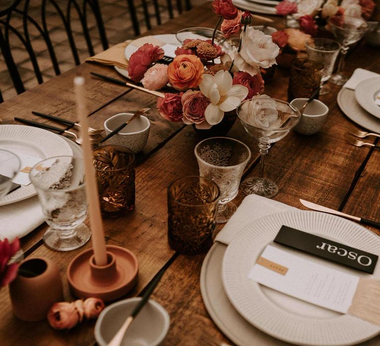 Table Settings with Coloured Goblets, Candle Sticks, Ornate Tableware and Black Stationery