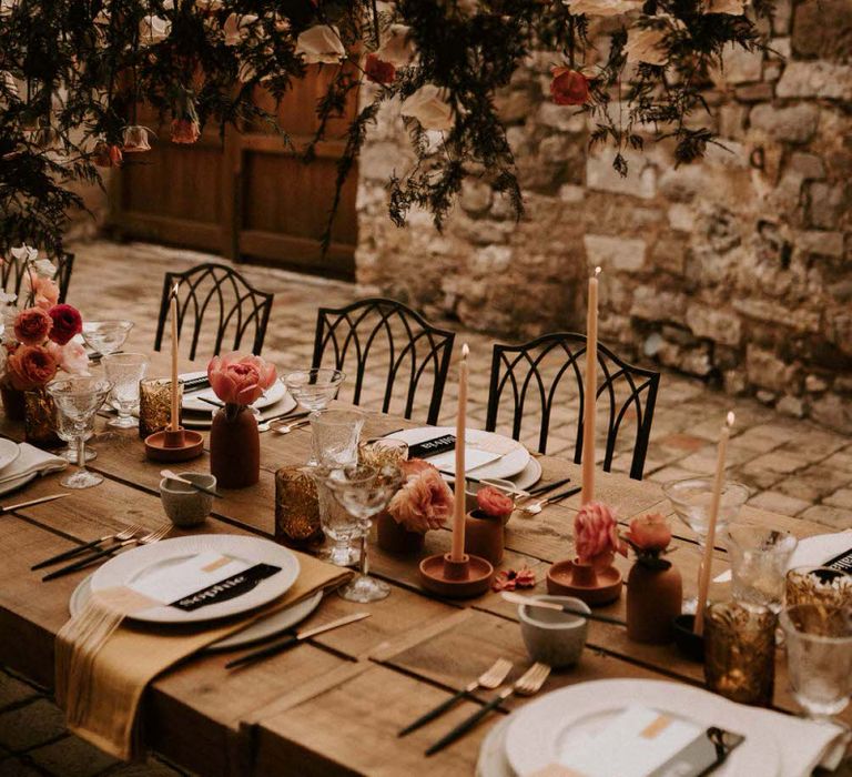 Hanging Flower Stems Over Wedding Reception Table