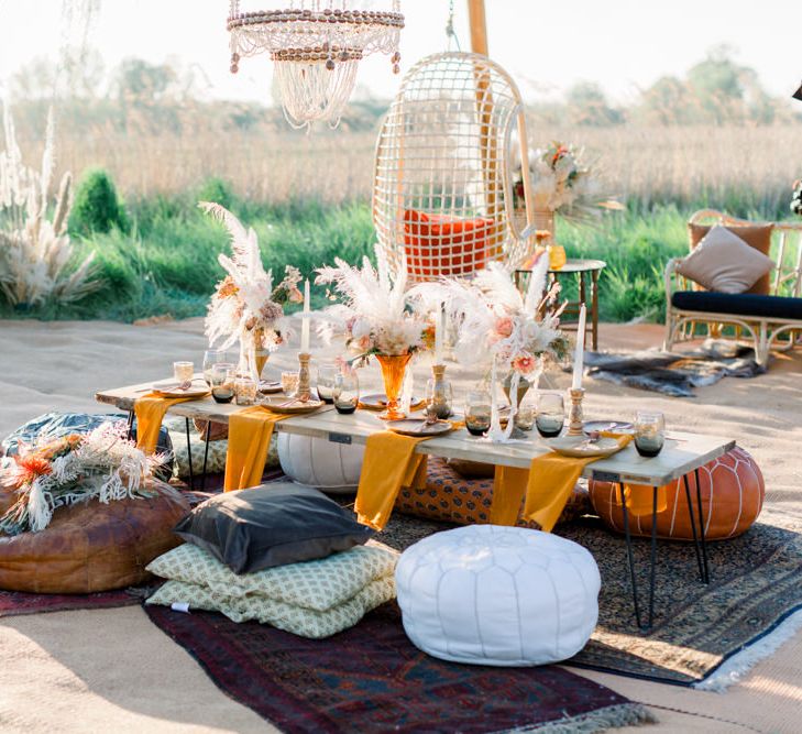 Relaxed Tablescape with Moroccan Poufs, Dried Flower Arrangements and Persian Rugs