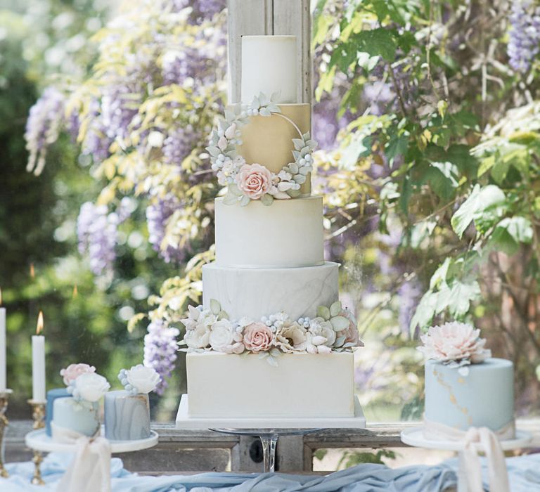 Dessert Table For Wedding With Iced Cake With Sugar Flowers // Winter Wedding Inspiration At Sennowe Park Norfolk With Cornflower Blue And Gold Details With Images From Salsabil Morrison Photography