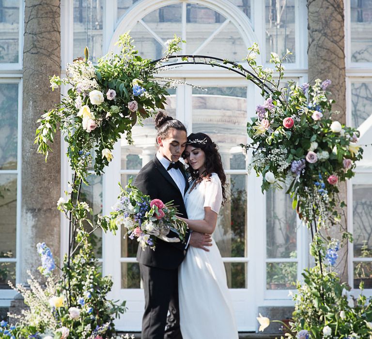 Floral Arch For Wedding Ceremony // Winter Wedding Inspiration At Sennowe Park Norfolk With Cornflower Blue And Gold Details With Images From Salsabil Morrison Photography