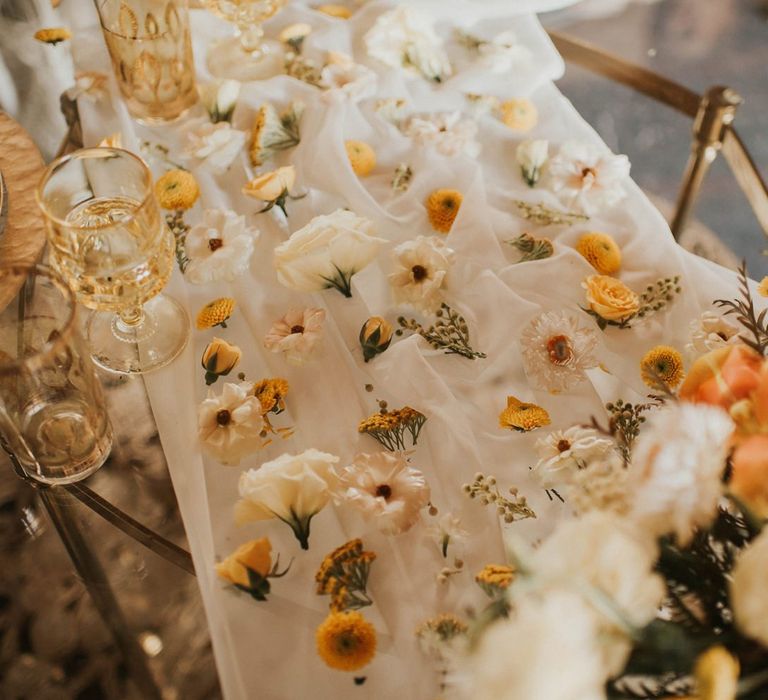 Flower table runner for Vegas Elopement with sparkly wedding dress