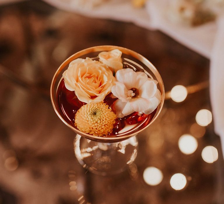 Champagne Saucer willed with flower heads