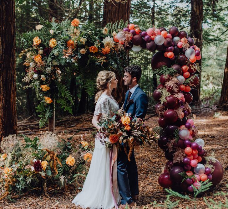 Balloon And Floral Arch For Wedding Ceremony At Patrick's Barn Woodland Industrial Wedding Venue With Grazing Board Style Food Images By Brigitte &amp; Thierry Photography