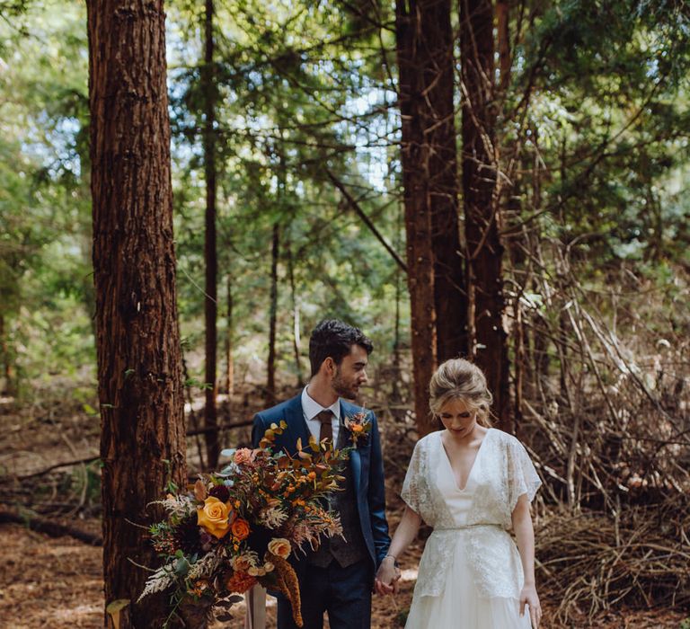 Autumnal Outdoor Wedding Reception In A Woodland // Balloon And Floral Arch For Wedding Ceremony At Patrick's Barn Woodland Industrial Wedding Venue With Grazing Board Style Food Images By Brigitte &amp; Thierry Photography