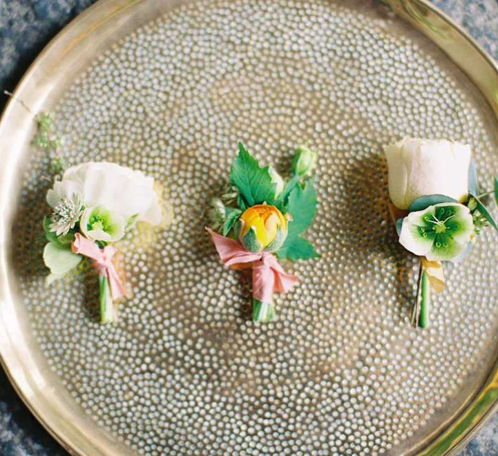 Small Yellow and White Buttonholes on a Gold Tray