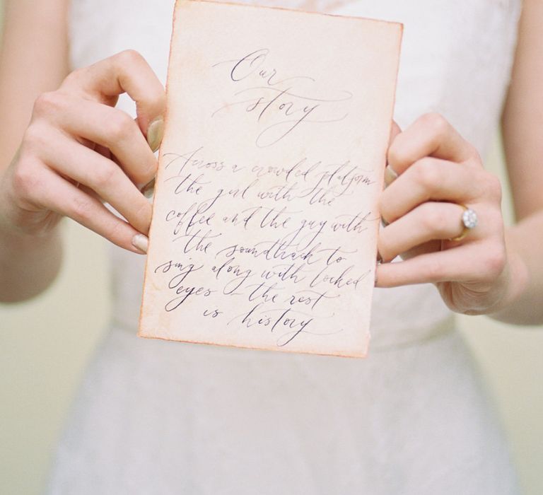 Bride Holding a Vintage Calligraphy Love Letter