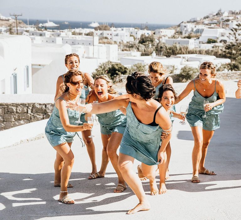 Bridal party in matching pyjamas during preparations in Mykonos