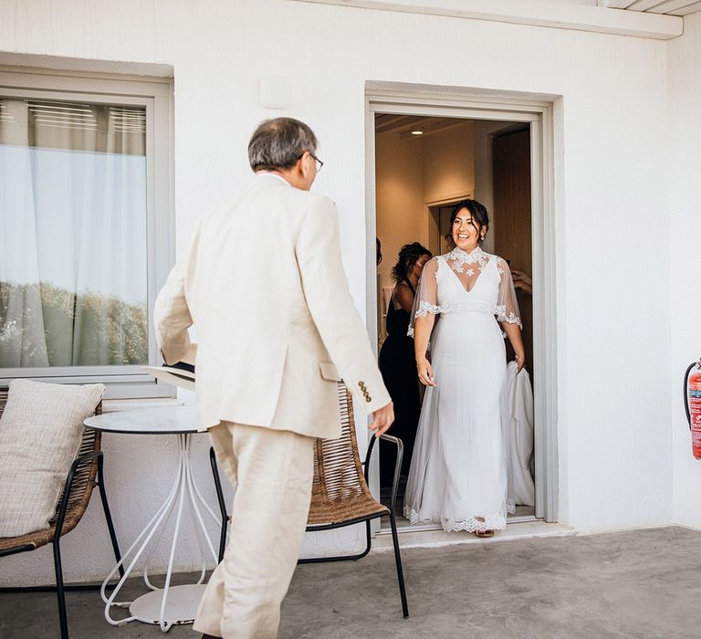 Bride appears in wedding capelet