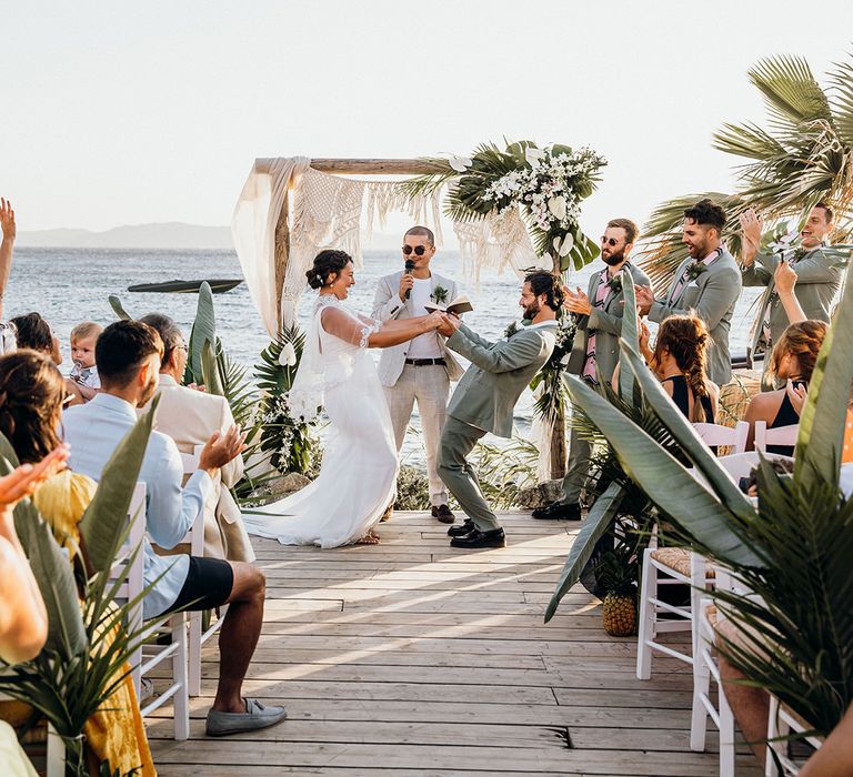 Bride and groom celebrate during ceremony