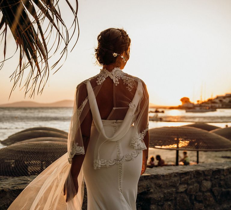 Cowl back wedding dress with wedding capelet over