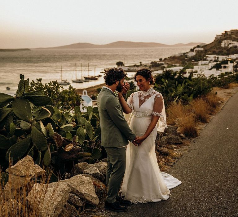 Bride and groom steal a moment together during the sunset in Mykonos