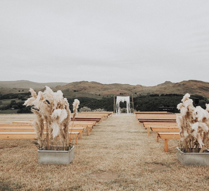 Outdoor Wedding Ceremony with Pampas Grass Floral Arrangements