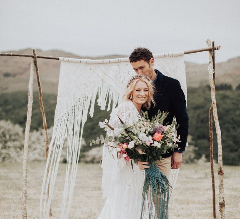 Groom in Navy Blazer &amp; Beige Chinos Kissing His Brides Head