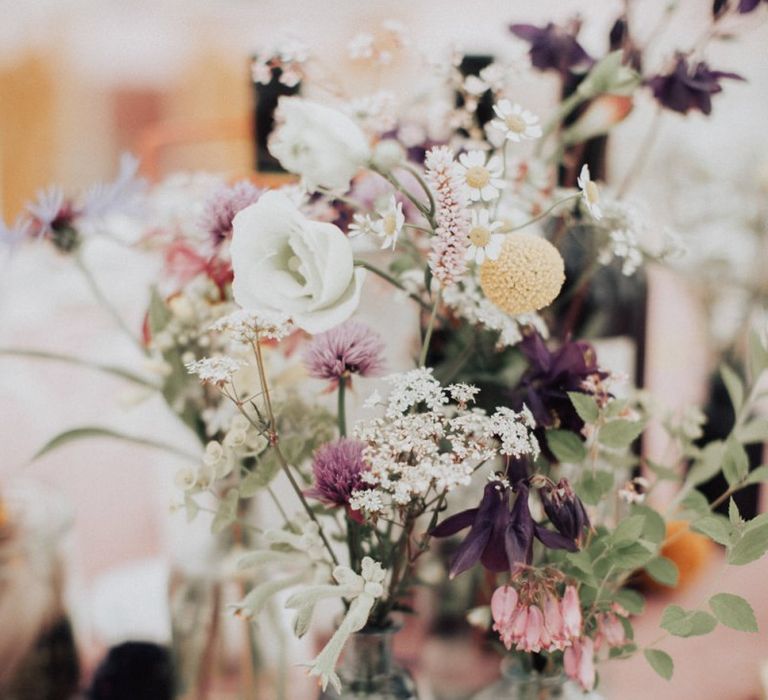 Wildflower Stems in Bottles as Wedding Decor