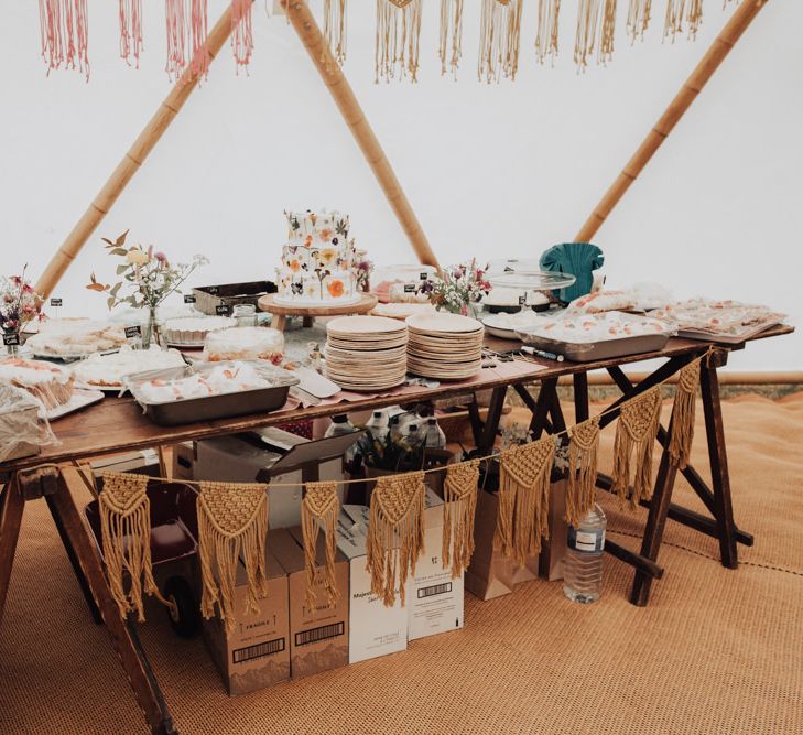 Dessert Table with Homemade Wedding Cake Decorated with Edible Flowers