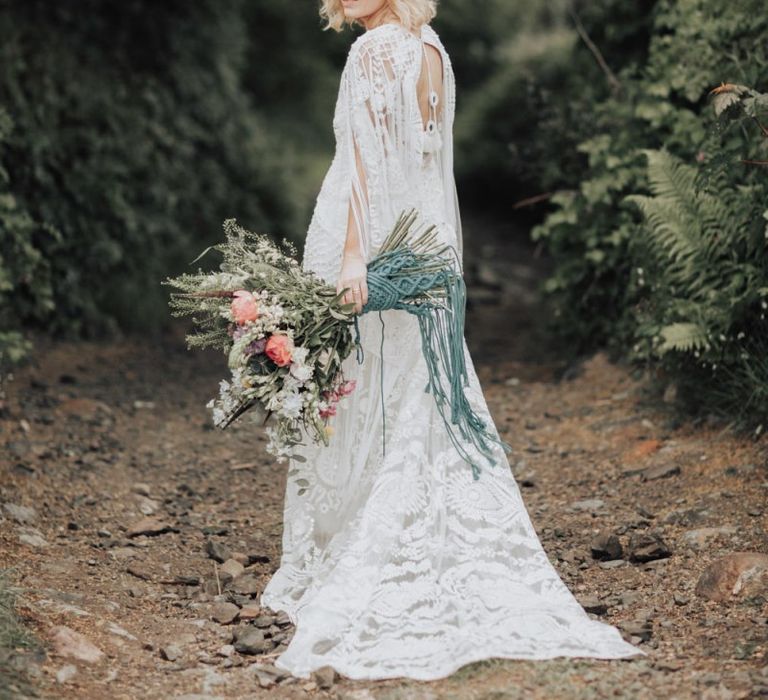 Boho Bride in Rue de Seine Wedding Dress Holding a Spring Wedding Bouquet  Tied with Macrame