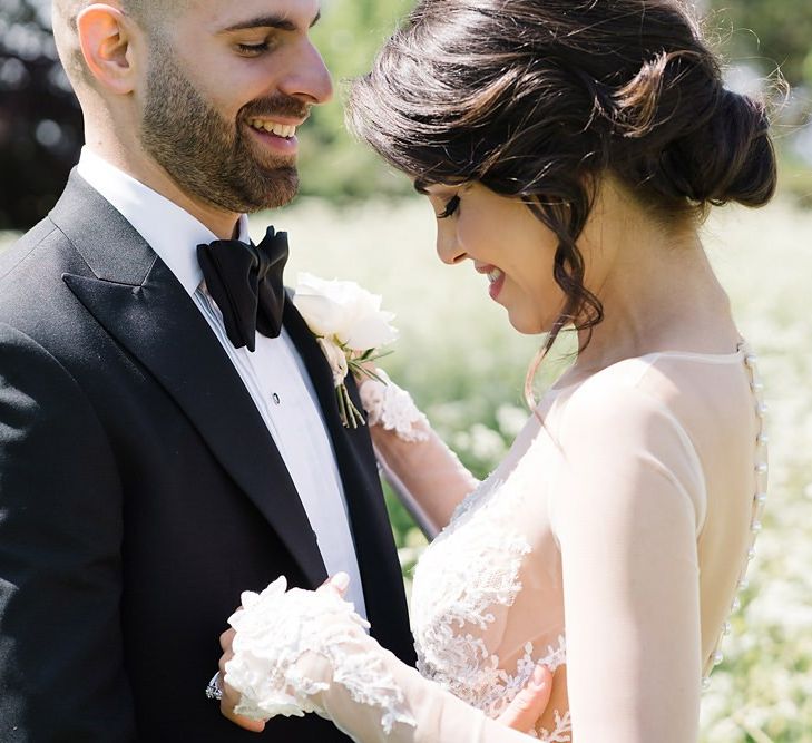 Intimate Bride and Groom Portrait in Black Tie Wedding Outfits