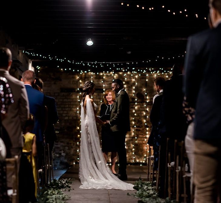 Wedding ceremony at Trinity Buoy Wharf with bride in Grace Loves Lace Rosa wedding dress