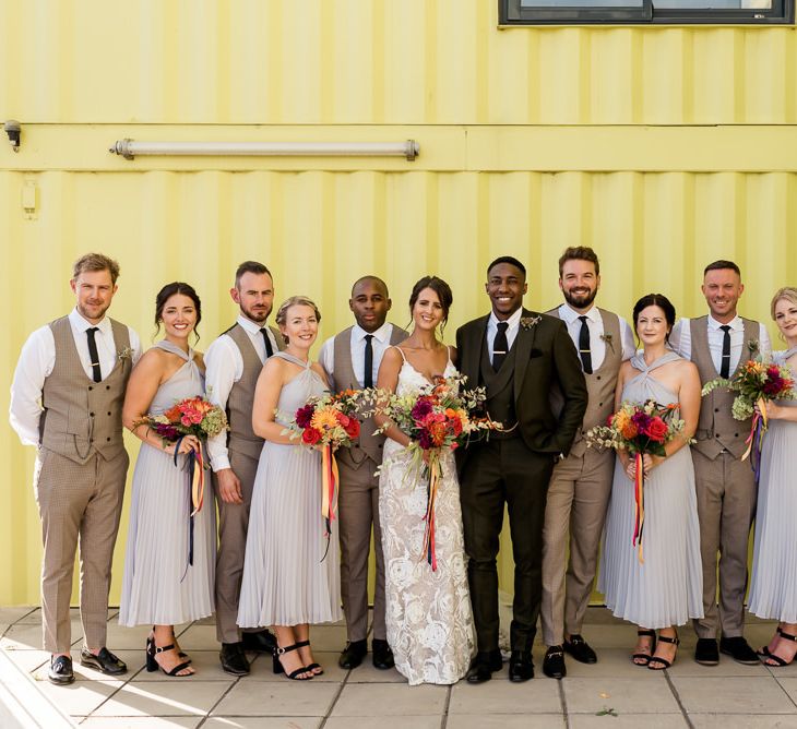 Wedding party portrait at trinity buoy wharf with bride in Grace Loves Lace Rosa wedding dress