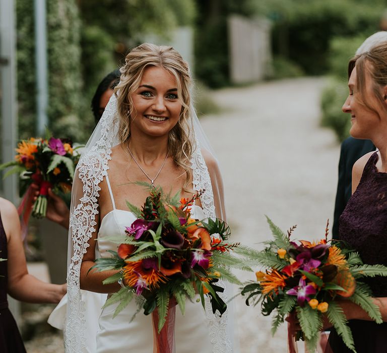 Flowers by Amanda Randell | Tropical Humanist Wedding Outside | Custom Enzoani Gown and Veil | Lucy Turnbull Photography