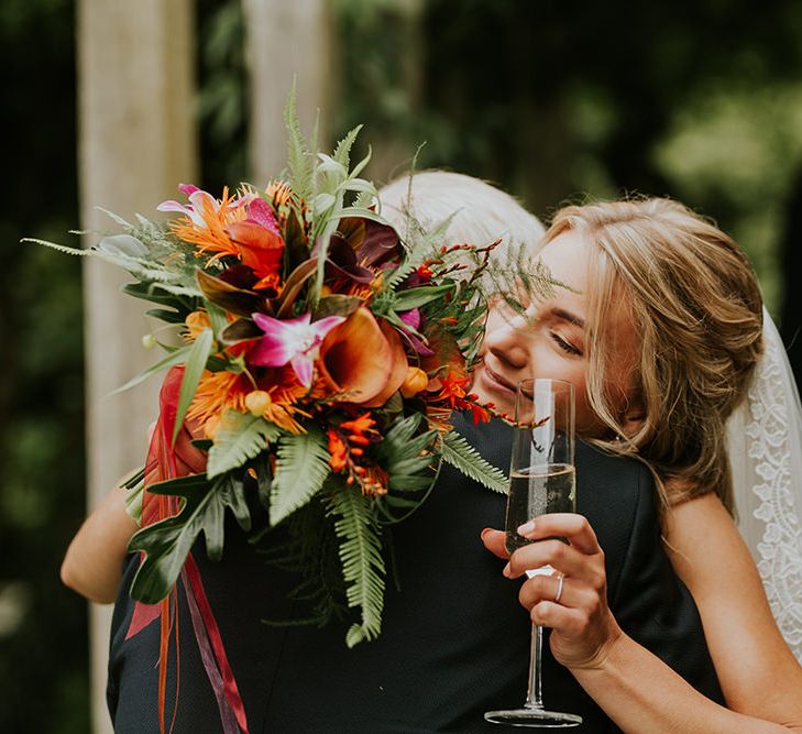 Flowers by Amanda Randell | Tropical Humanist Wedding Outside | Custom Enzoani Gown and Veil | Lucy Turnbull Photography