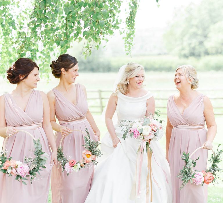 Bridesmaids With Floral Hoops Instead Of Bouquets