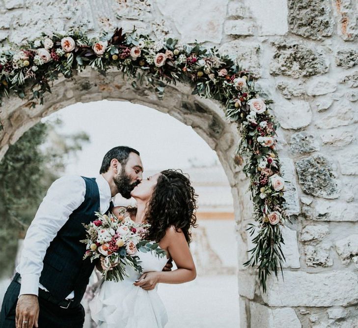 Pink flower arch at Greek wedding