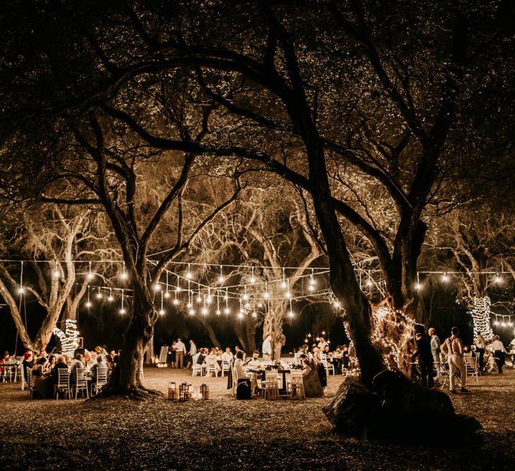 Festoon lighting at outdoor wedding