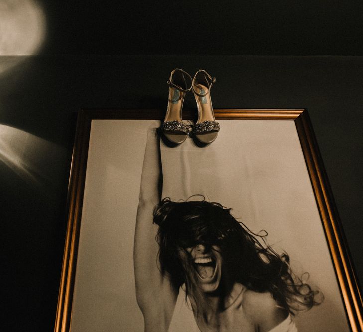 Jewelled Wedding Shoes Hanging Up on Wedding Morning