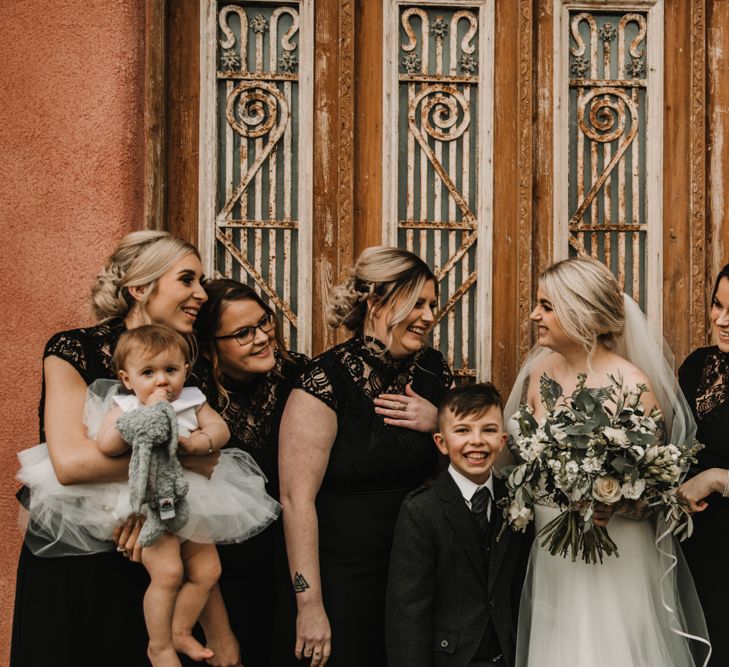 Bridal Party Portrait with Bride in Mermaid Wedding Dress and Bridesmaids in Black Lace Dresses