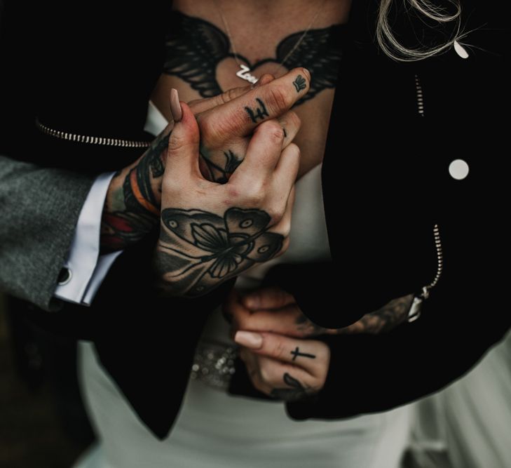 Tattooed Bride and Groom Embracing