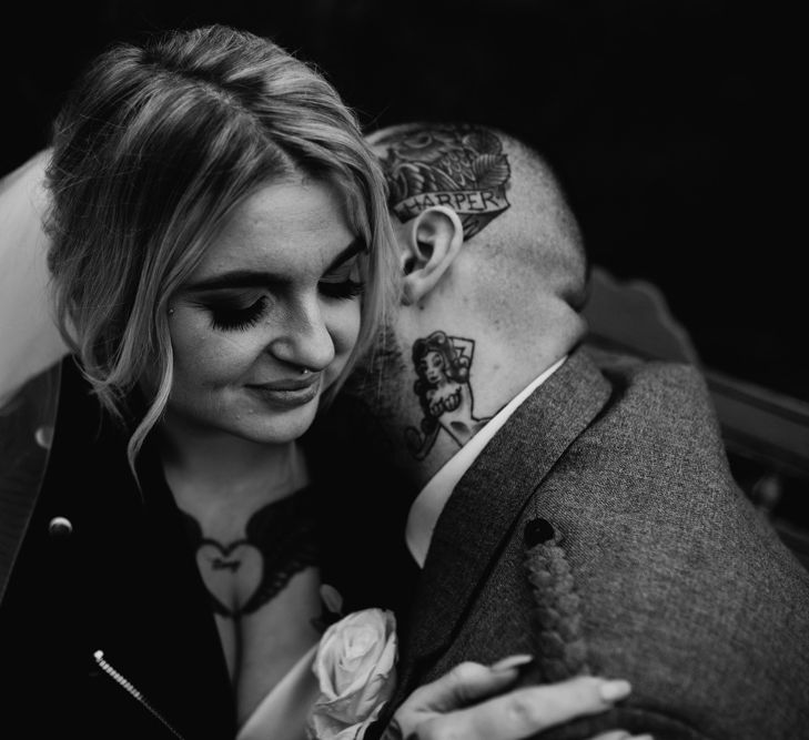 Tattooed Groom Kissing His Brides Neck in Leather Jacket