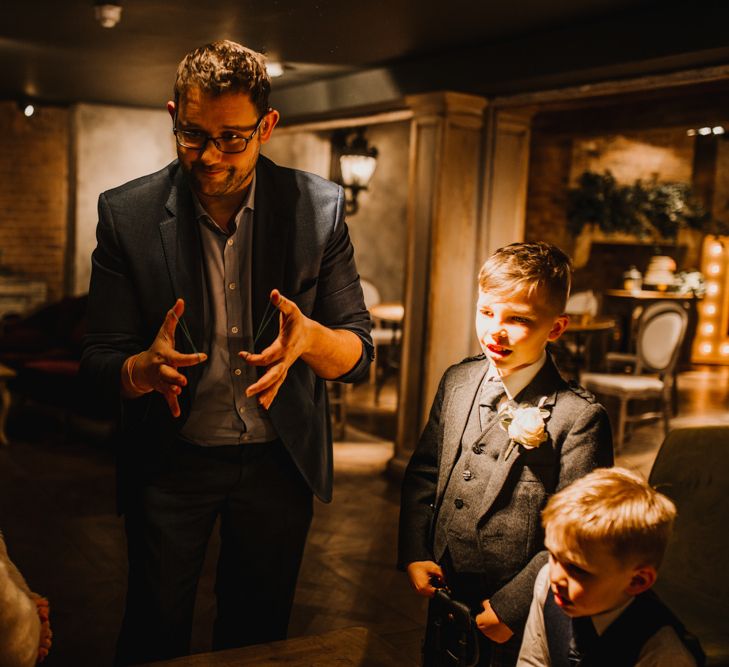 Magician Wedding Entertainer Performing a Trick