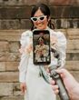 Wedding content creator filming bride with retro sunglasses on