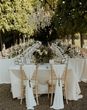 Sweetheart table for modern seating arrangement at outdoor wedding