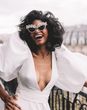 Bride wearing pearl bridal sunglasses for Parisian elopement wedding