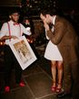 a live wedding illustrator produces a painting wedding keepsake