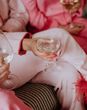Galentine's theme ideas with groups of friends in pink feather pyjamas 