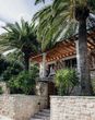 Exterior of Villa Dalmacija in Croatia with palm tress for 2026 honeymoon
