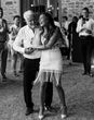 Bride dancing with the father of the bride in a white shirt