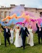 Wedding party at the Grange Hampshire wedding venue with colour smoke cannons