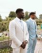 Light blue best man wedding suit and white groom suit
