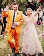 groom wearing colourful, unique mustard orange groom on wedding day